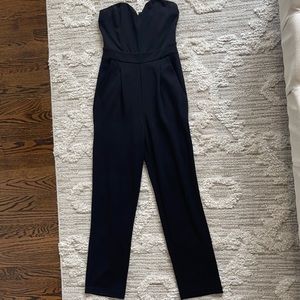 Black strapless jumpsuit with pockets